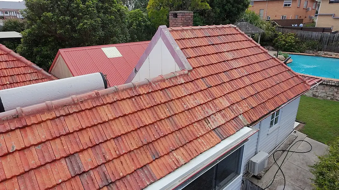 The same terracotta roof after the treatment programme, tiles and pointing intact