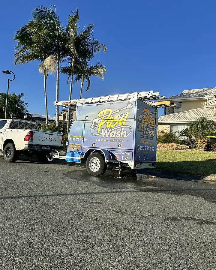 The blue Posh Wash trailer hitched to a white ute on a Brisbane street