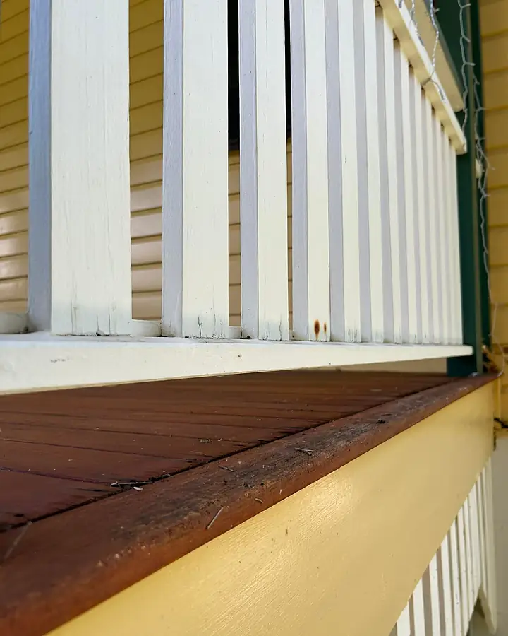 The same Queenslander balustrade and sill clean after a soft wash