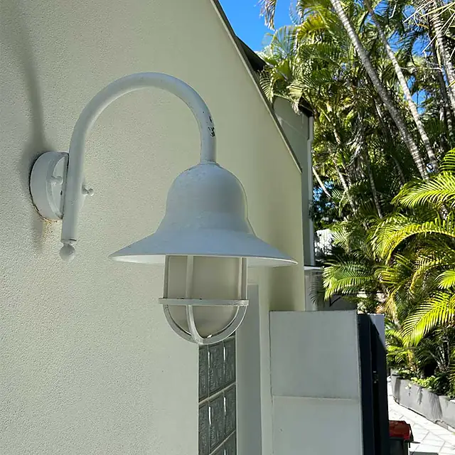 The same lamp and wall clean and white after washing