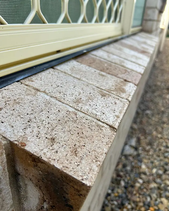 The same pale brick sill clean after washing