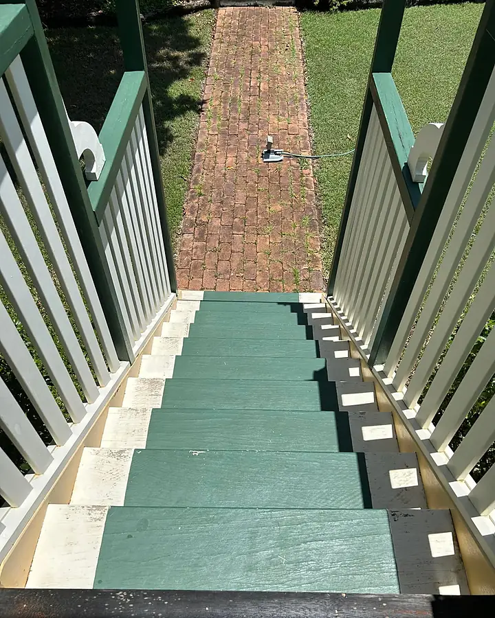 The same painted steps and brick path cleaner after washing